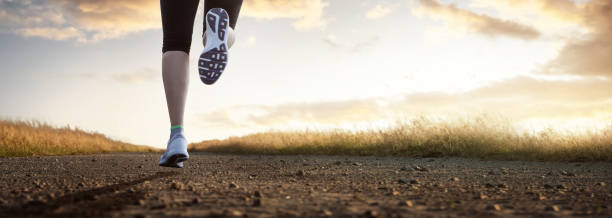 istock Woman jogging in the morning sun 1086560700