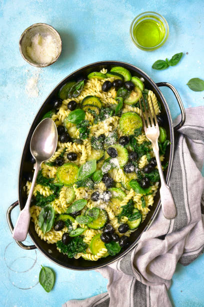 Summer pasta with green vegetables and black olives