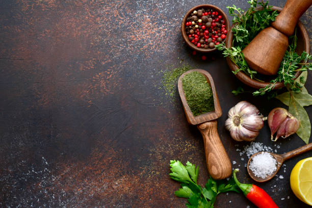 istock Culinary background with selection of spices, herbs and greens 1086565954