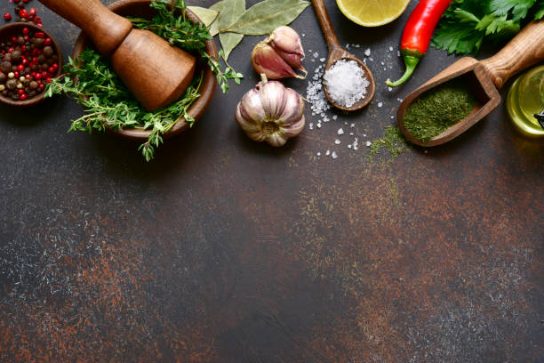 istock Culinary background with selection of spices, herbs and greens 1086565976