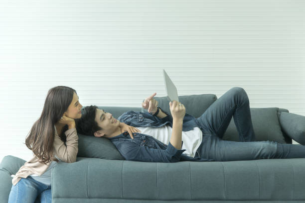 istock A couple relaxing at home. 1086566054