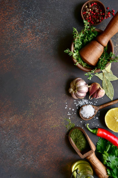 istock Culinary background with selection of spices, herbs and greens 1086566060