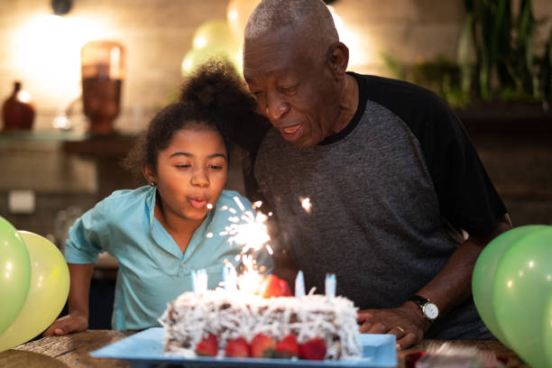 istock Granddaughter Celebrating Birthday Party 1086574208