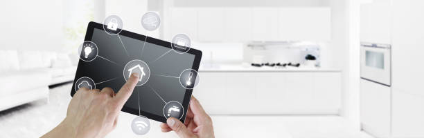 istock smart home automation control hand touch digital tablet screen with white symbols on kitchen and living room  background web banner and copy space template 1086574292