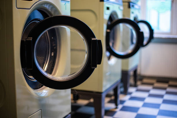 Laundromat Washing machines Laundromat Washing machines tumble dryer stock pictures, royalty-free photos & images