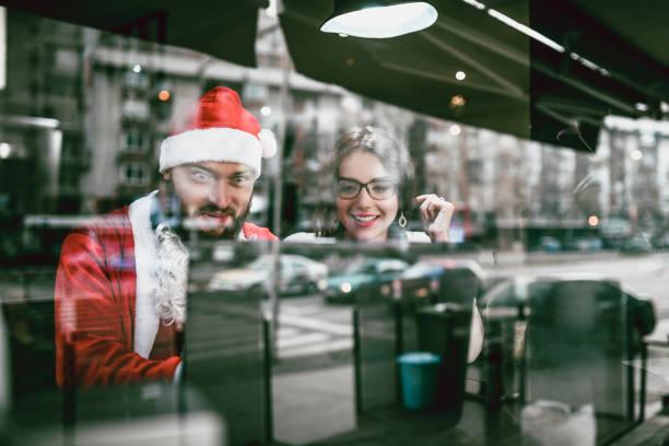 istock Handsome Santa And His Assistant Checking The Presents Destinations 1086579384