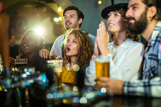 istock Happy Friends watching soccer 1086580416