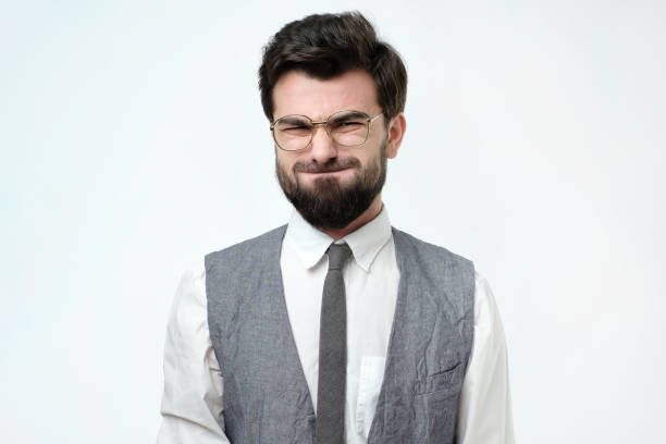 istock Funny young man grimacing, inflating cheeks, holding his breath. 1086581710