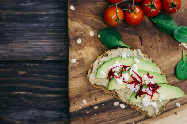 istock avocado sandwich on wooden board 1086585702
