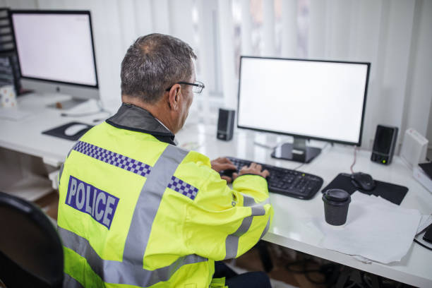 istock British police officer working at the office 1086585780