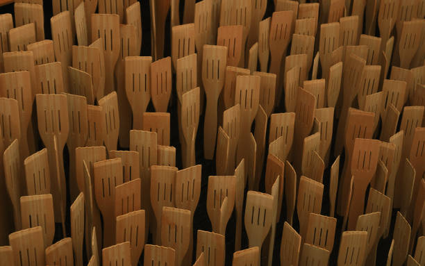 istock Standing slotted Wooden spoons abstract composition background - Culinary concept 1086586028