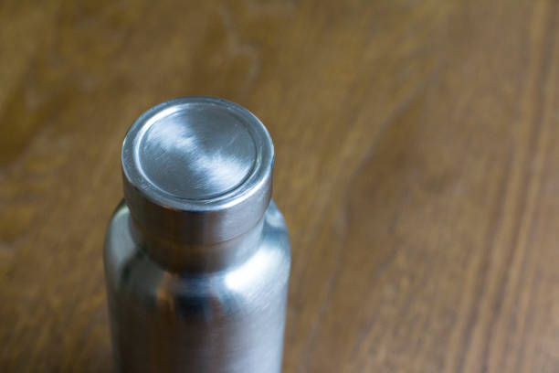 istock Insulated Stainless Bottle on the wooden table 1086586148