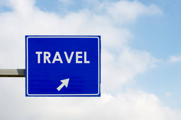 istock Travel word displayed on blue road sign 1086597020