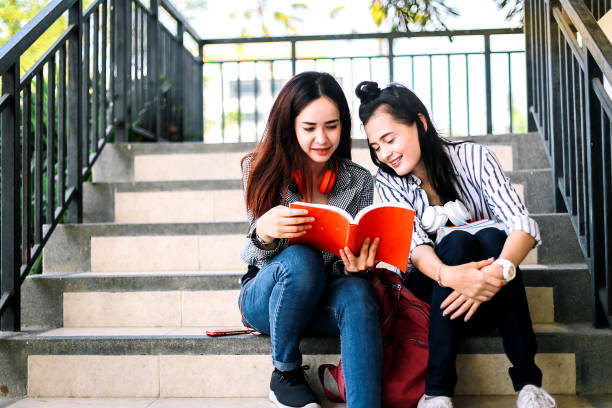 istock Education concept - Asian young woman are standing read book. 1086602742