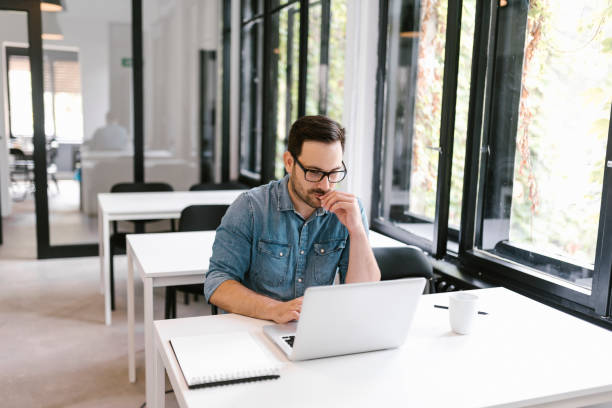 istock Portrait of a focused handsome man doing research. 1086603042