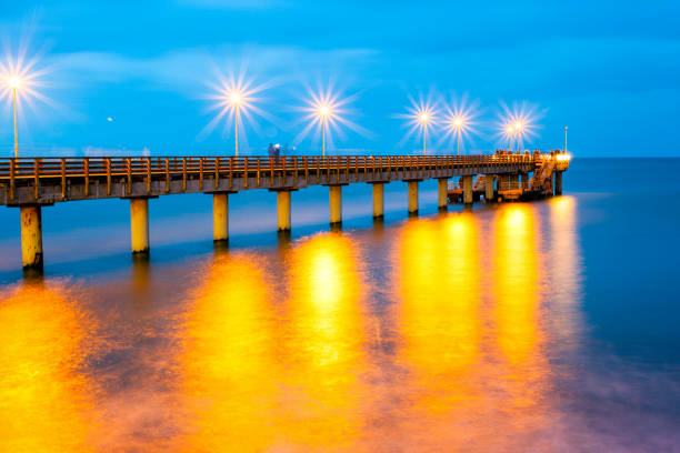 istock pier and a beautiful cloudy sky above the sea, long exposure 1086607258