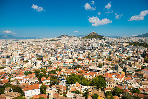 Beautiful city view on Athens streets and Mount Lycabettus from the Acropolis hill.