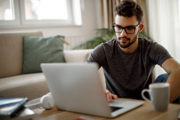 istock Teenage boy using social media at home 1086608214