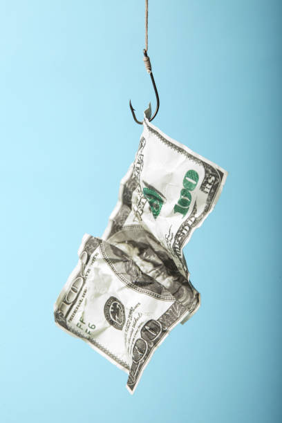 istock Money scam, lure of one hundred dollars 1086612832