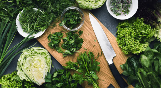 istock Cutting greenery assortment on kitchen wooden board 1086614428