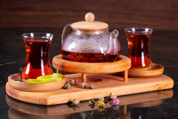 istock traditional turkish tea cup, tea ceremony, Cup of freshly brewed black tea, warm soft light, darker marble background 1086618338