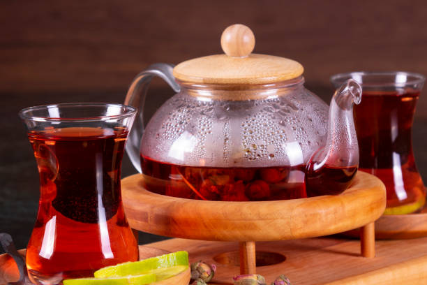 istock traditional turkish tea cup, tea ceremony, Cup of freshly brewed black tea, warm soft light, darker marble background 1086618370