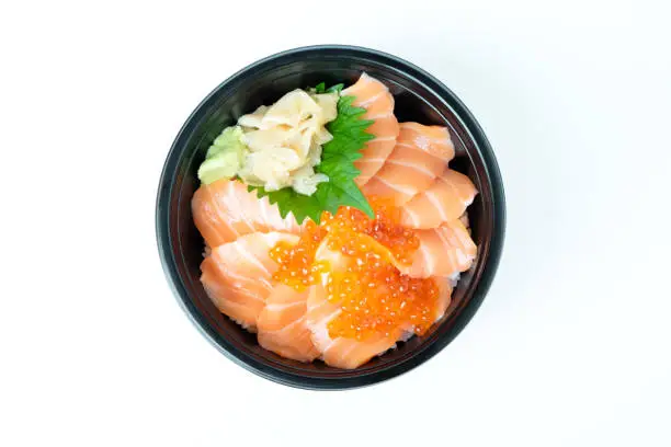 Salmon Donburi with ikura and pickled genger in plastic bowl