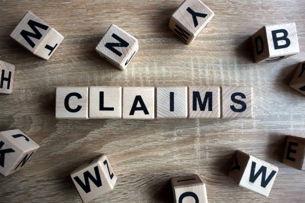Claims word from wooden blocks Claims word from wooden blocks on desk recover tab stock pictures, royalty-free photos & images