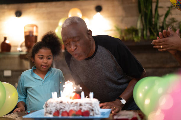 istock Granddaughter Celebrating Birthday Party 1086624710