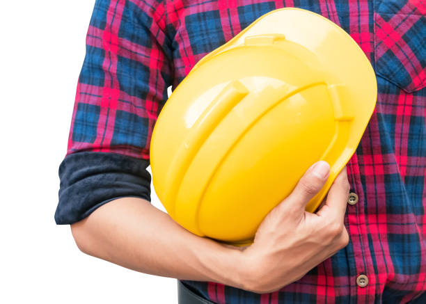 istock Engineer hold yellow safety helmet plastic construction concept  isolated on white background 1086630078