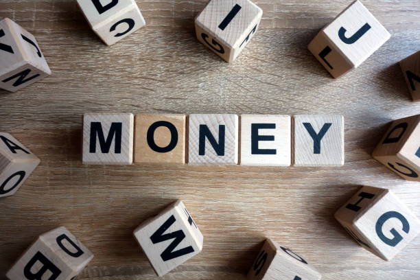 istock Money word from wooden blocks 1086630240