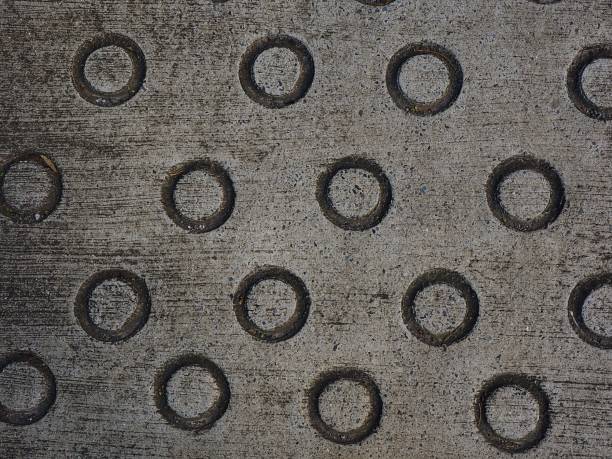 istock concrete road surfece with circle pattern for anti slip 1086632520