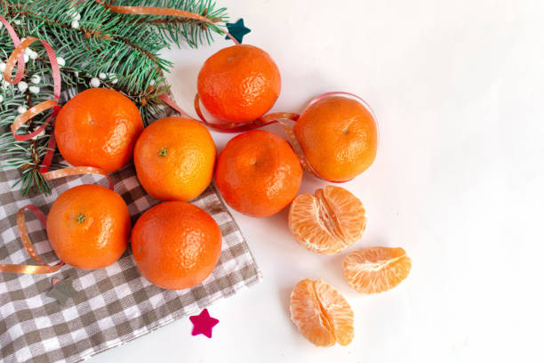 istock Mandarins fruits top view on white decorated table background. 1086641460