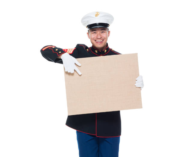 istock US Marine in uniform holding placard 1086642110
