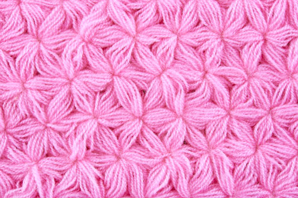 istock Pink woolen texture background. Macro of knitted cloth 1086643472