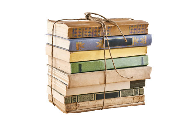 istock Bundle of old books tied up with string. Isolated on white backg 1086643482
