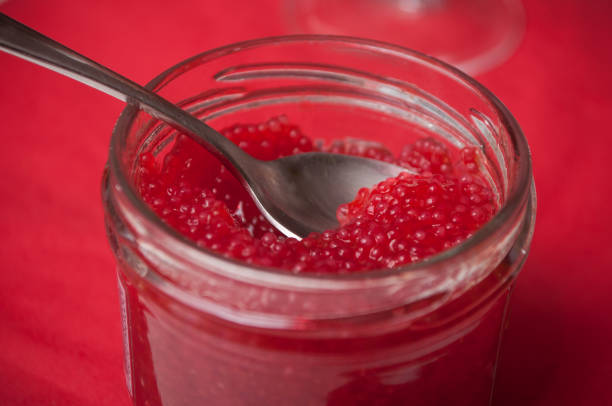 istock red lumpfish roe in spoon on festive table 1086643998