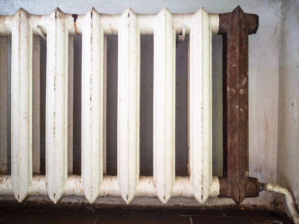 istock shabby household cast iron heating radiator 1086645514