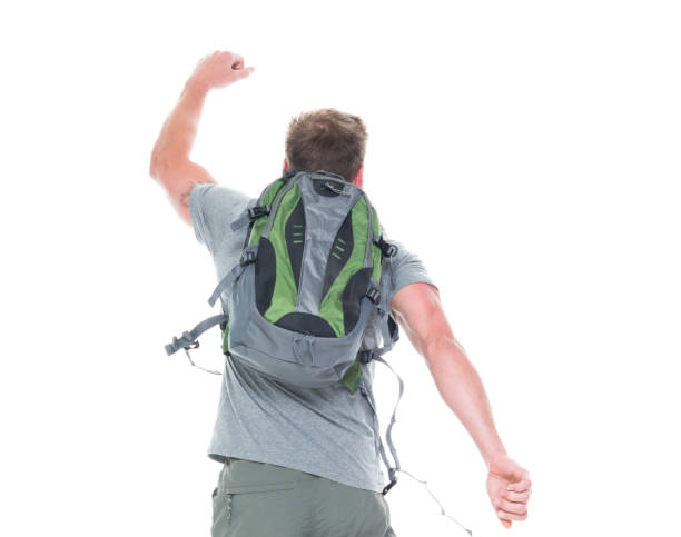 istock Friendly male hiker is jumping with excitement, rear view 1086648484