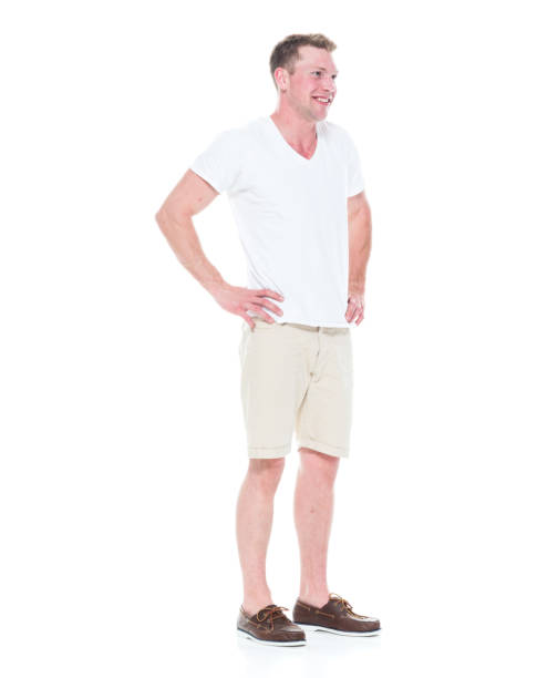 istock Handsome man in shirt and shorts has hands on hips 1086648736