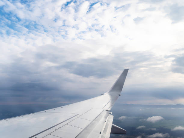 istock view of aircraft wing and land during flight 1086648872