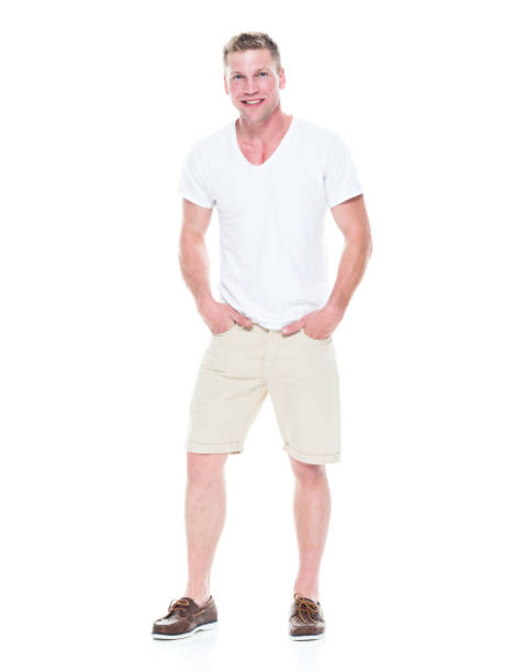 istock Handsome man in shirt and shorts has hands in pocket 1086648882