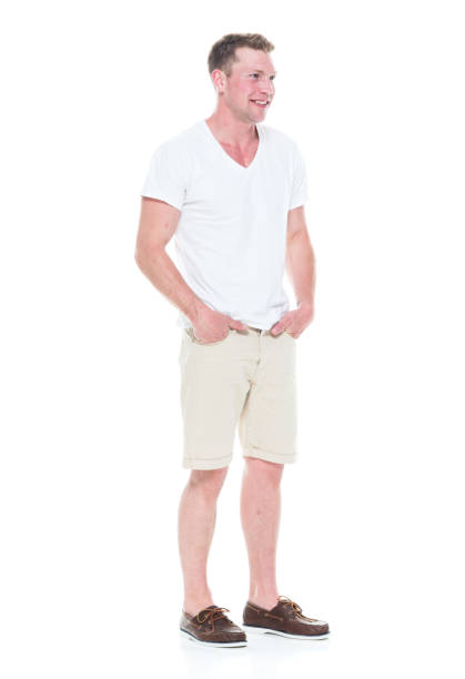 istock Handsome man in shirt and shorts has hands in pocket 1086648910