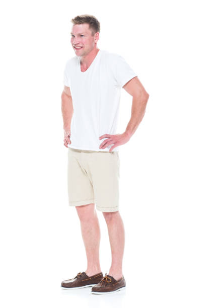 istock Handsome man in shirt and shorts has hands on hips 1086648934
