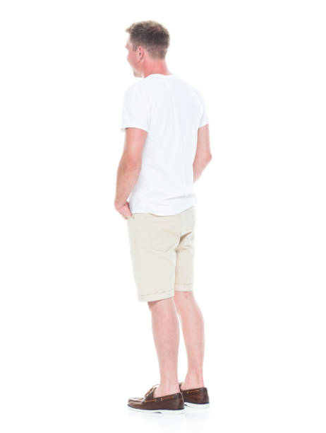 istock Handsome man in shirt and shorts has hands in pocket 1086648986