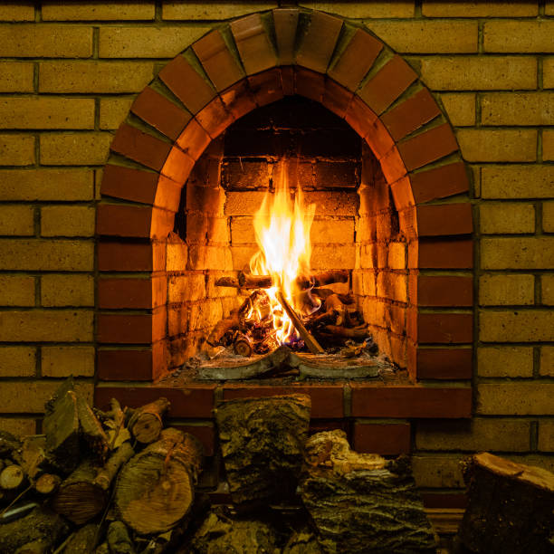 istock front view of fireplace with burning firewood 1086649578