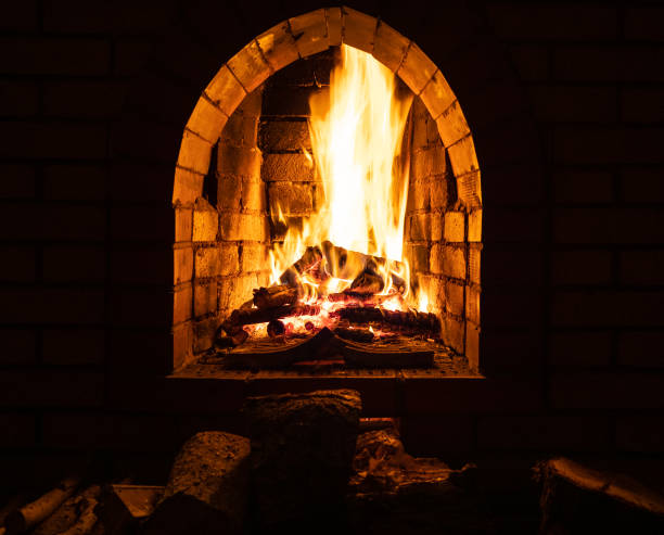 istock fireplace with burning firewood at night 1086649582