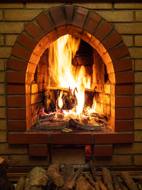 istock front view of fireplace with fire and firewood 1086649586