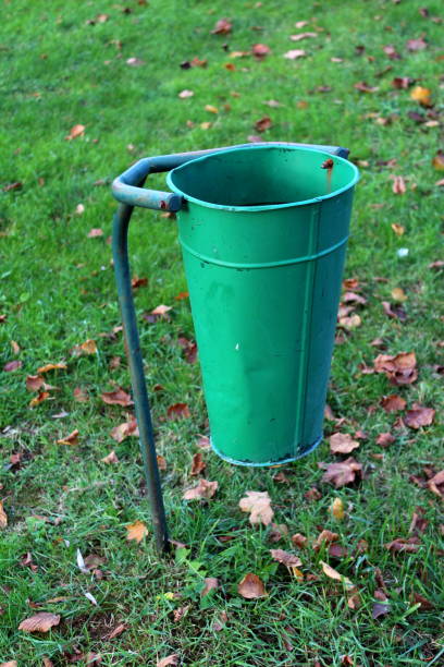 istock Green metal public trash can; 1086650178