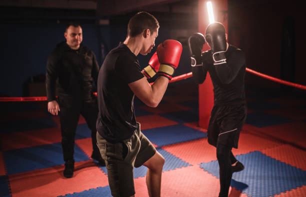 istock Kick boxers fight in the gym 1086657338